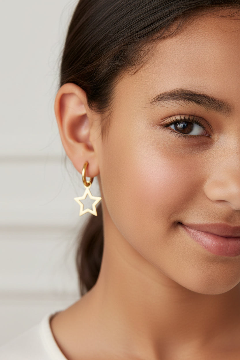 Star dangling golden earrings.